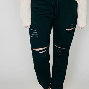 Black distressed joggers.